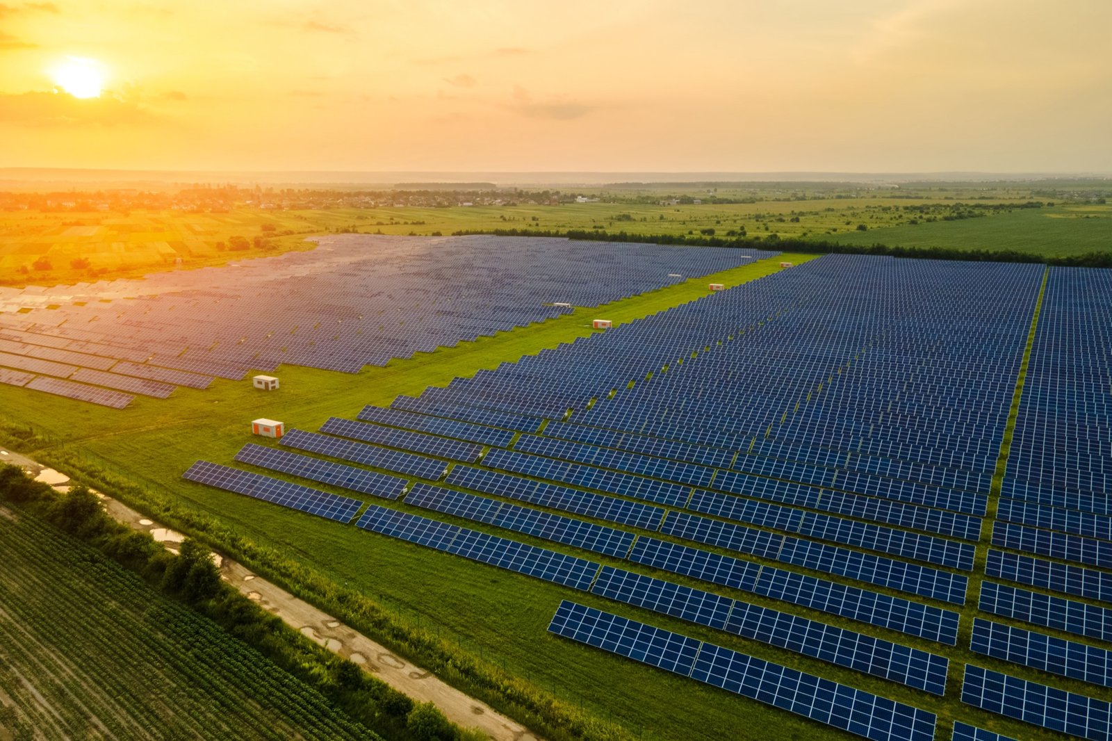 Utility-scale solar farm at sunset